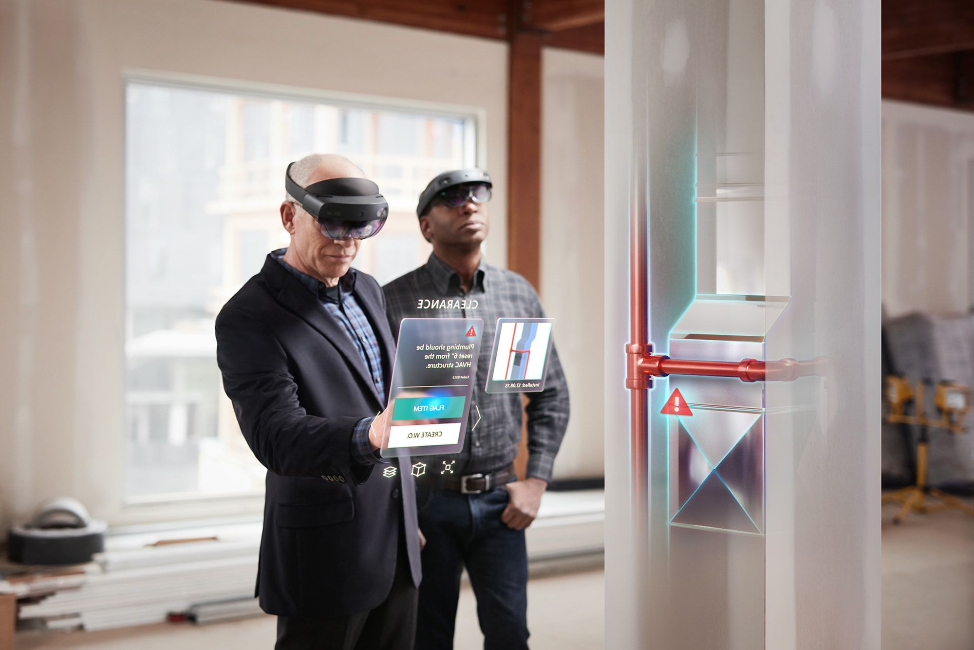 People wearing Hololens headsets and interacting with digital overlays.