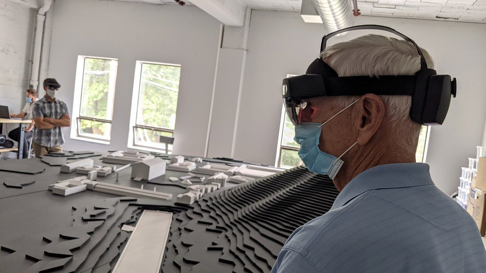People wearing Hololens headset.