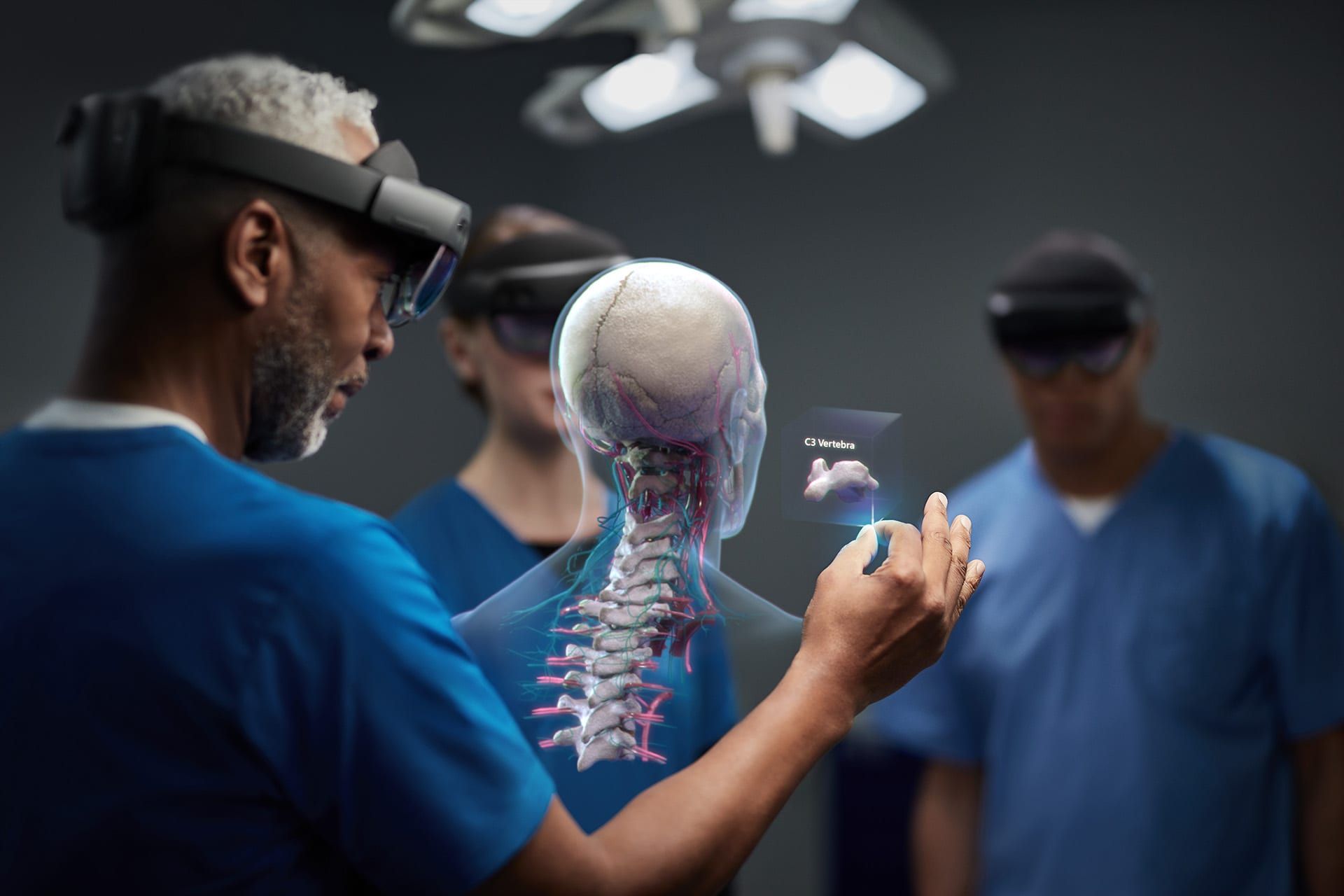 Dcotors wearing Hololens headsets and interacting with digital skeleton.