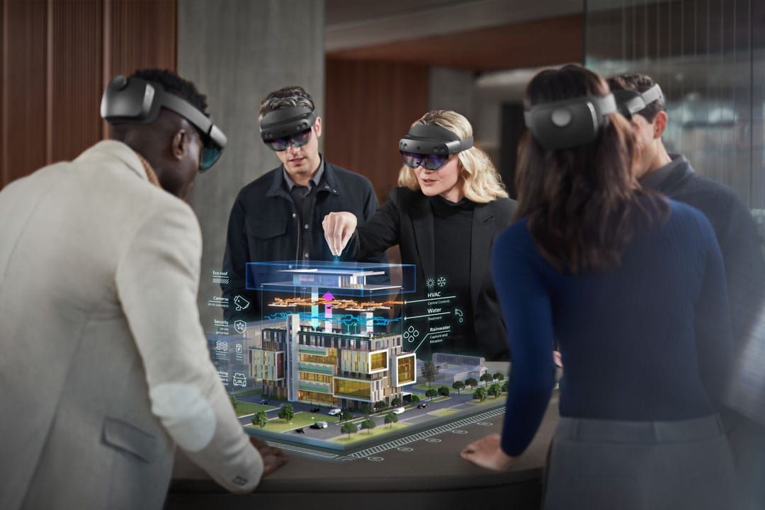 People wearing Hololens headsets and interacting with digital overlays.