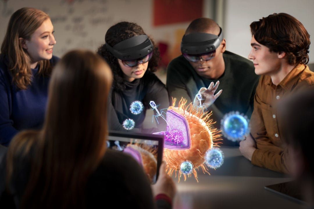People wearing Hololens headsets and interacting with digital overlays.
