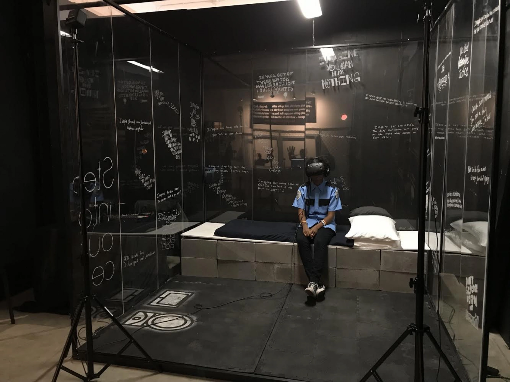 spatial prison cell experience with physical and virtual content