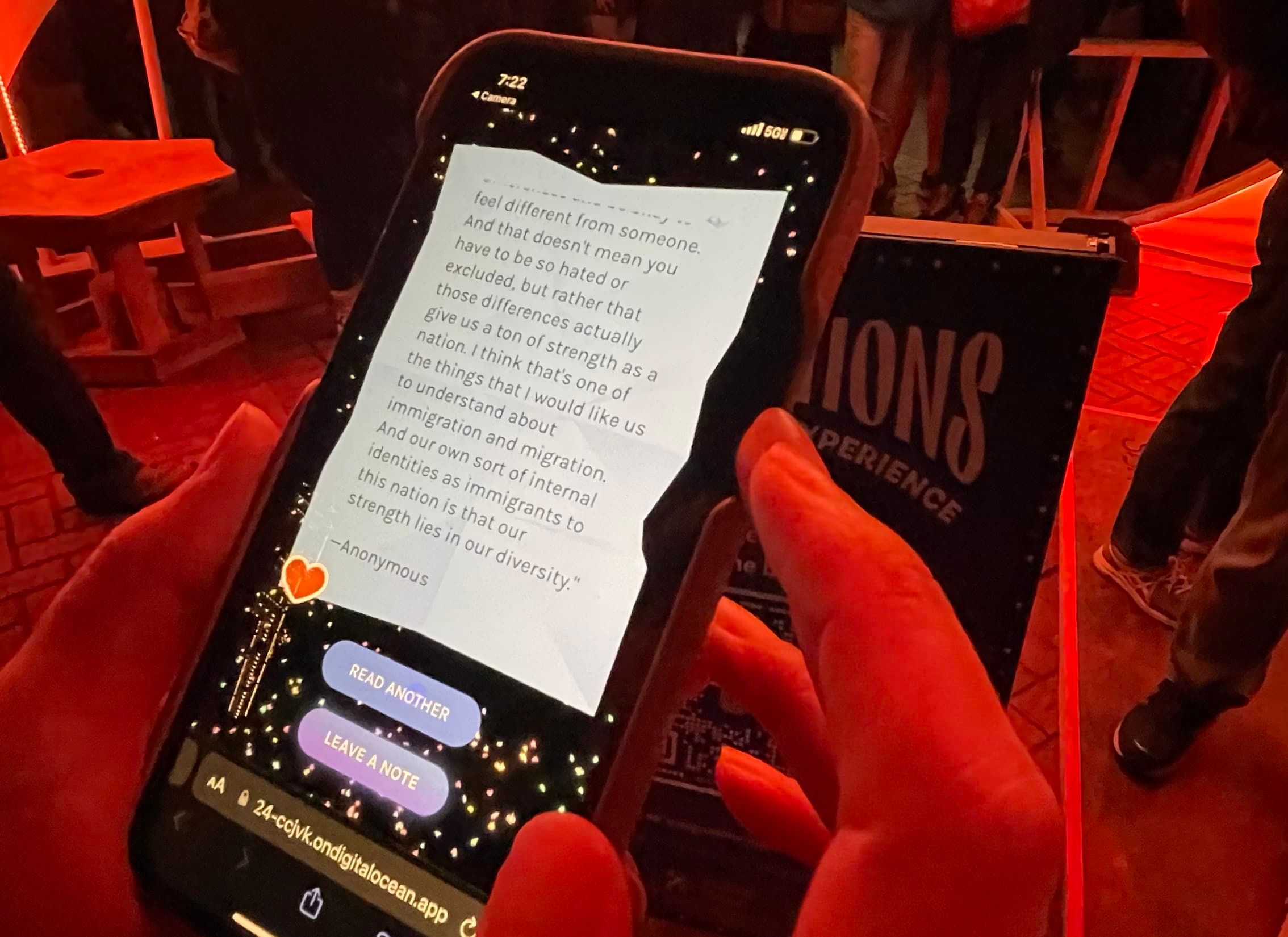 Yellow post-it note image on a cell phone screen with writing on it.